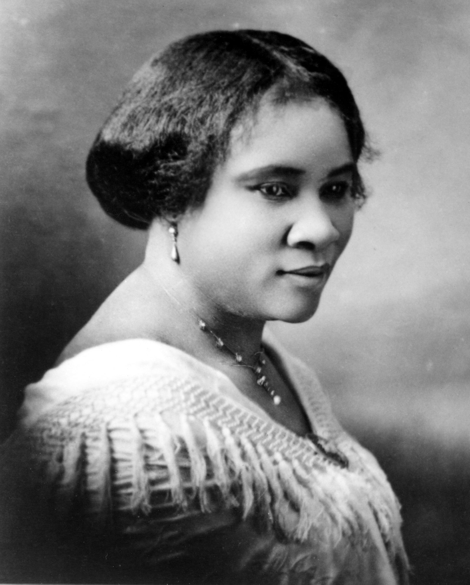 Image may contain Madam C. J. Walker Face Human Person Head Accessories and Accessory