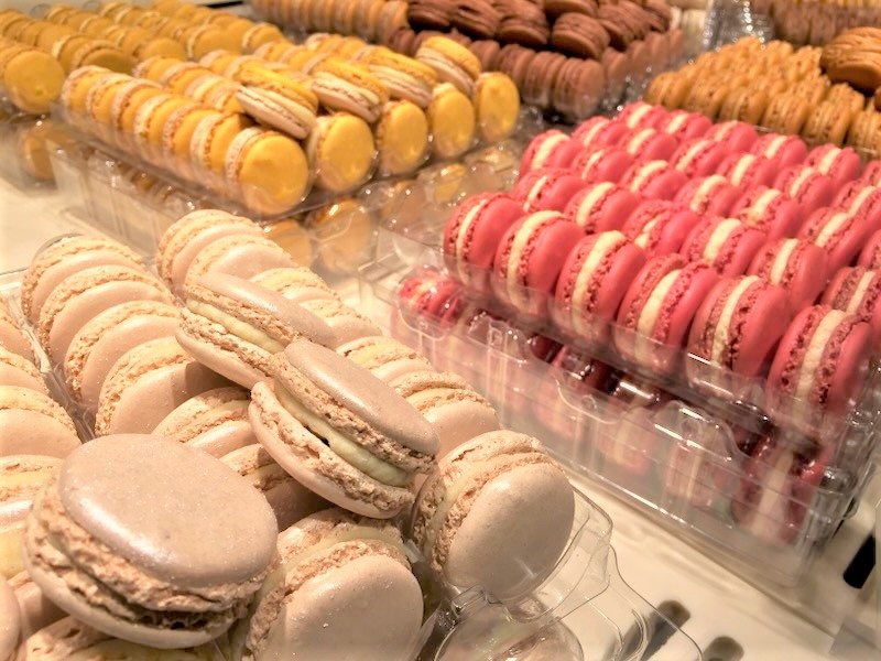 trays of colorful macarons