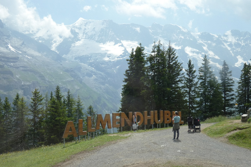 views of the mountains with an allmendhubel sign