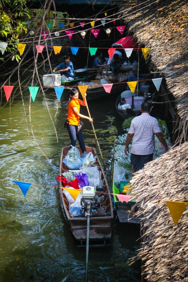 woman paddling down Bangkok Floating Markets