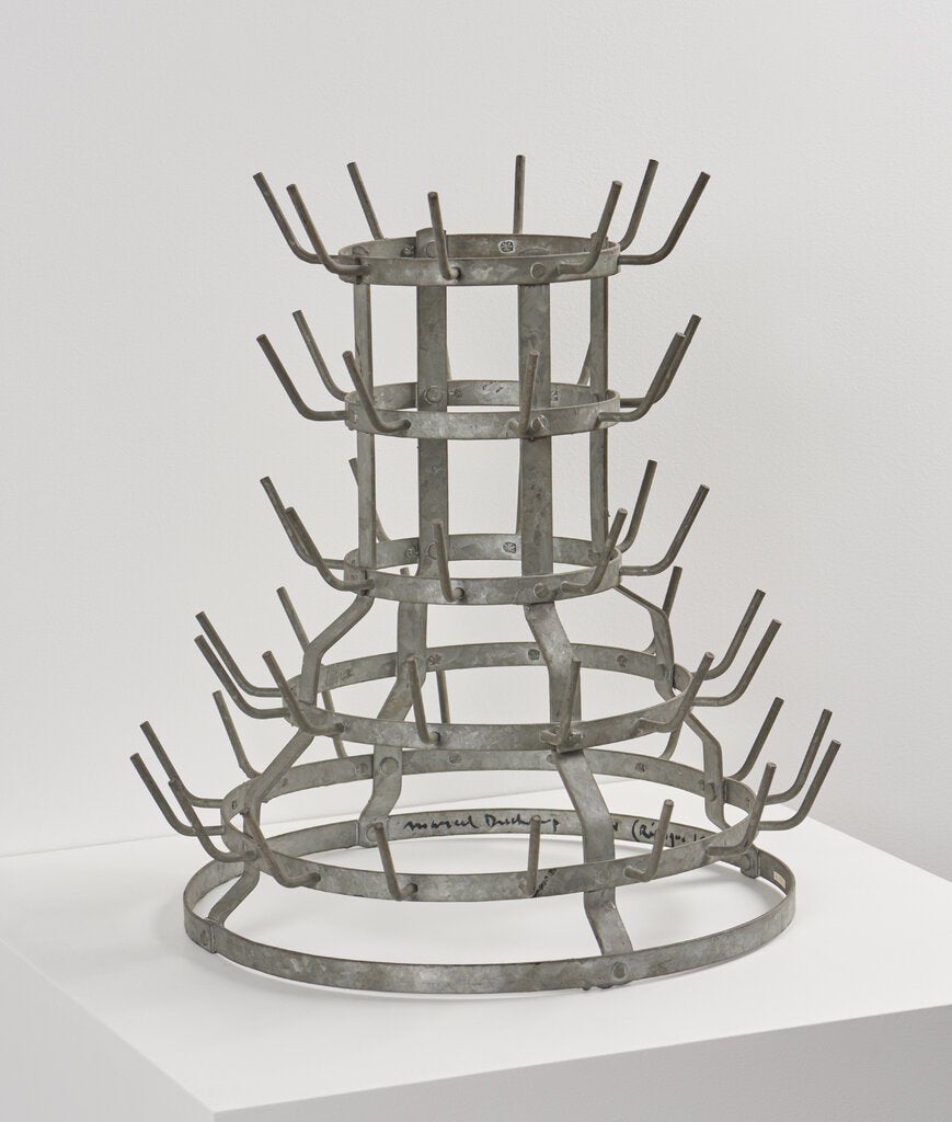 Signed tiered bottlerack by Marcel Duchamp, mass-produced, galvanized iron.