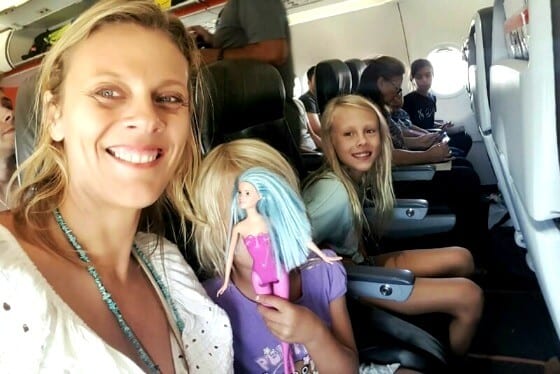 family posing on plane