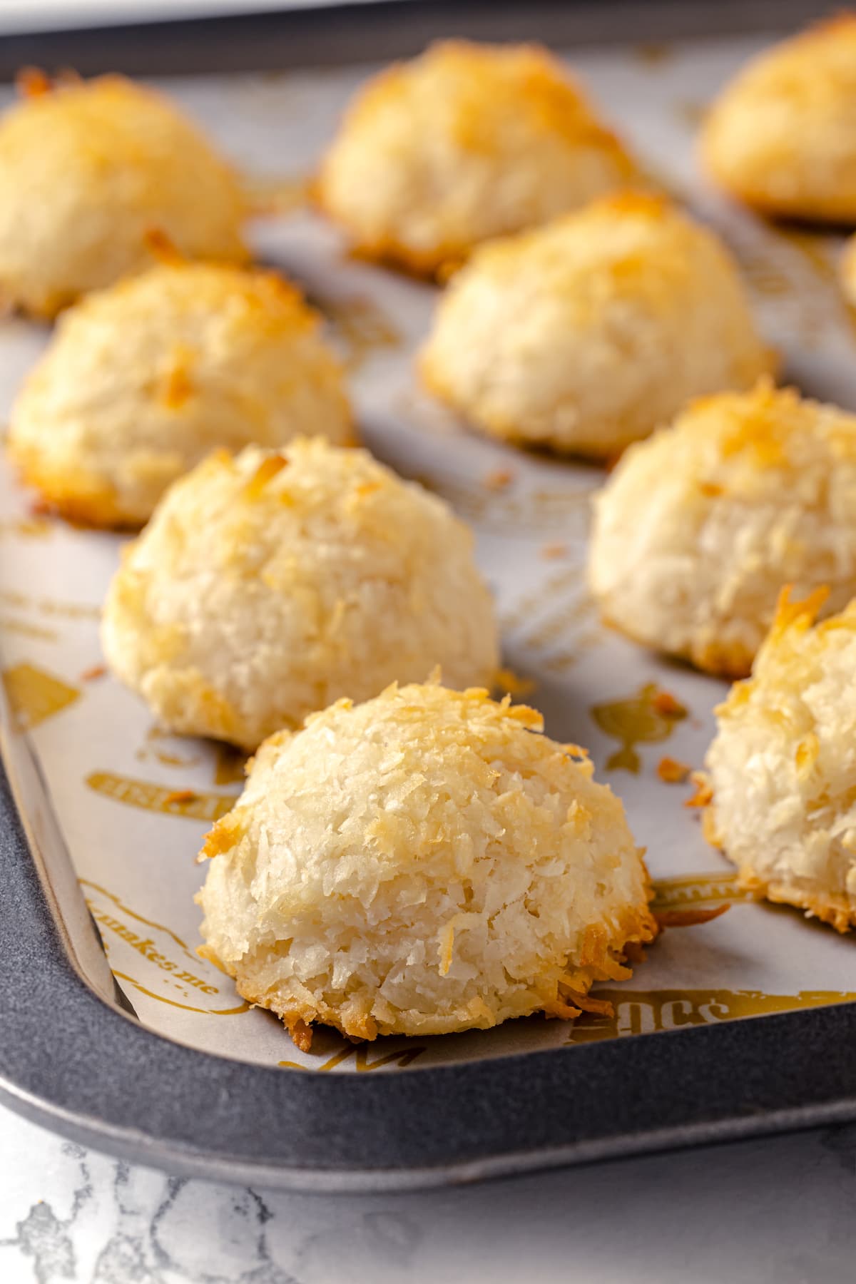 Close up of coconut macaroons on a baking sheet